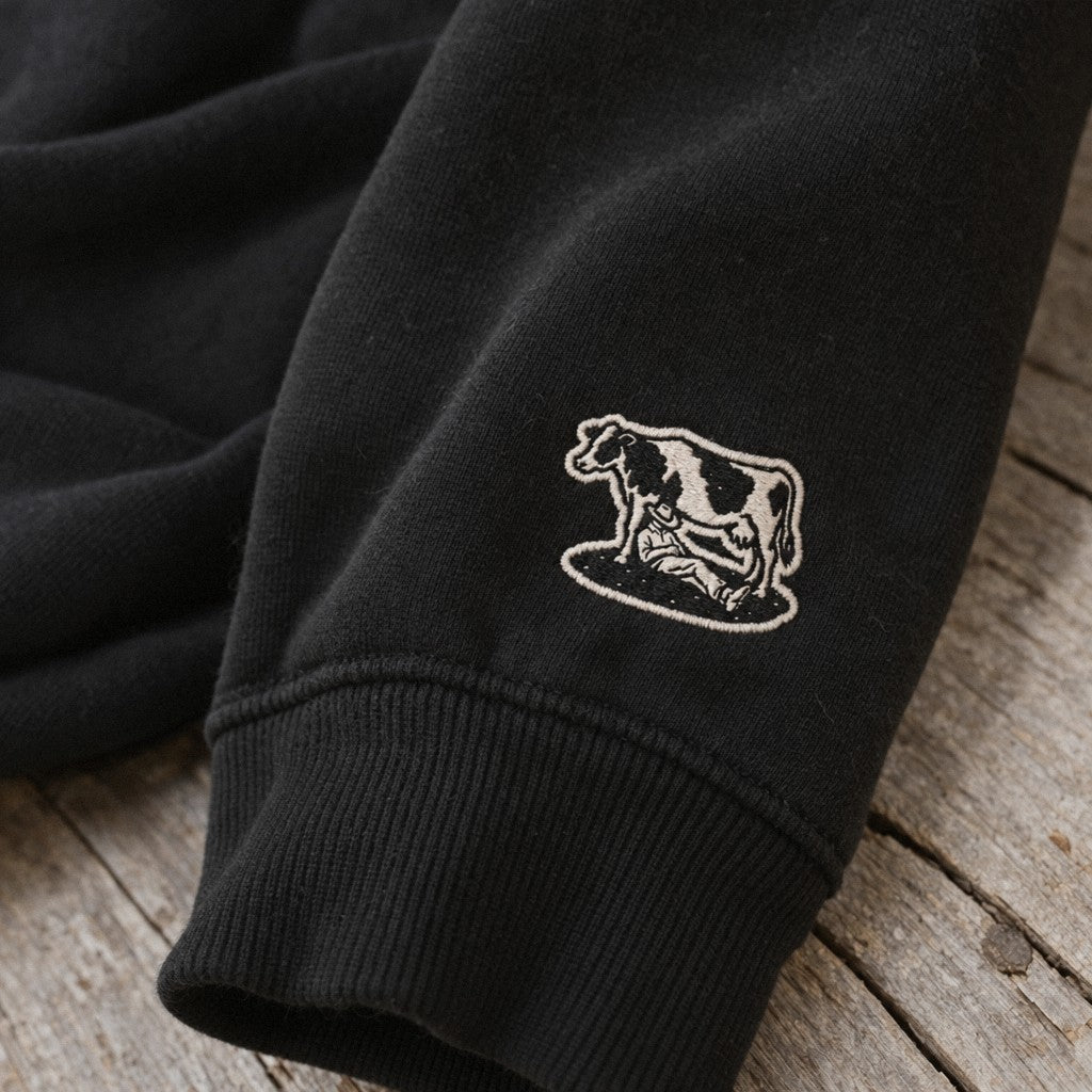 Afternoon Farmer Logo Crewneck in Black, close-up wrist