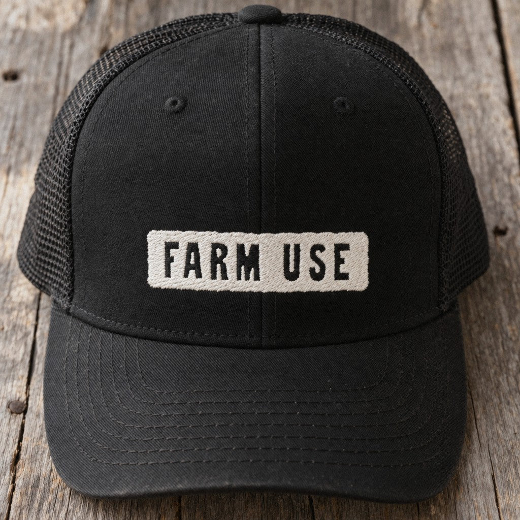 Farm Use Trucker Hat in Black, close-up front