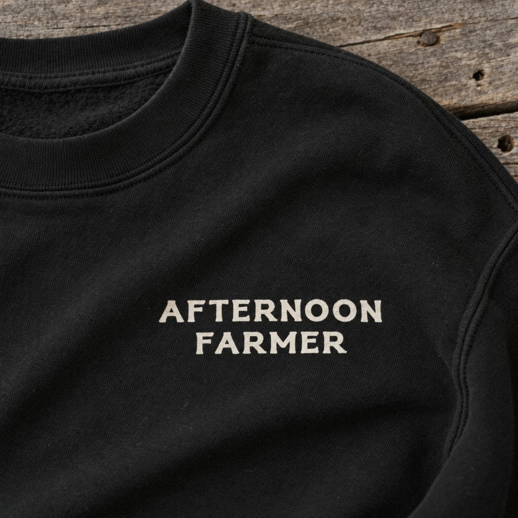 Afternoon Farmer Logo Crewneck in Black, close-up front