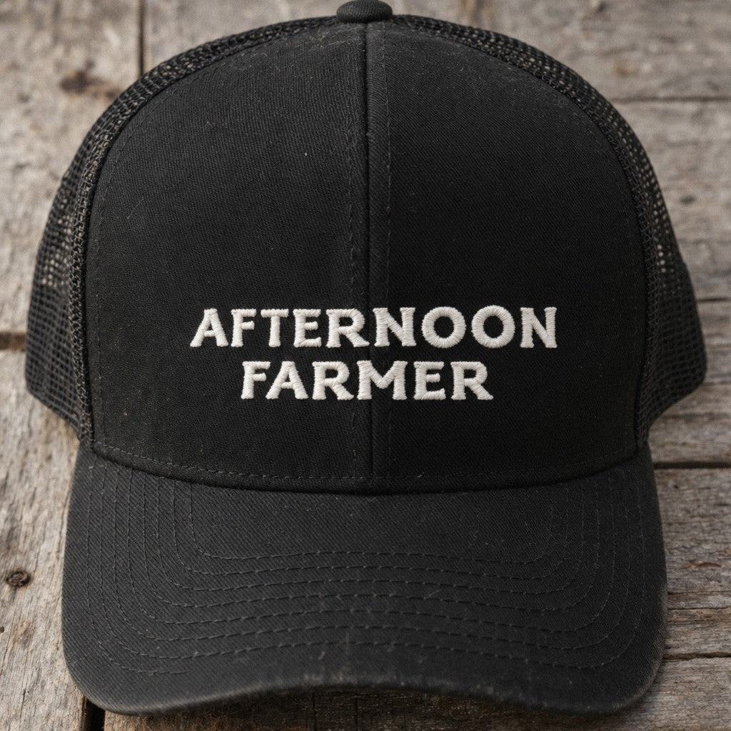 Afternoon Farmer Trucker Hat in Black, close-up front