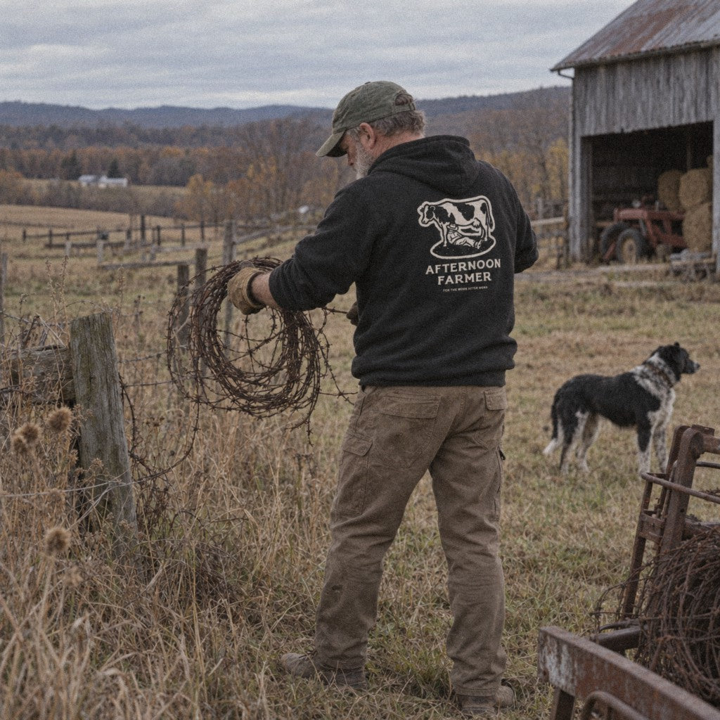 Afternoon Farmer Logo Hoodie in Black, carrying old wire