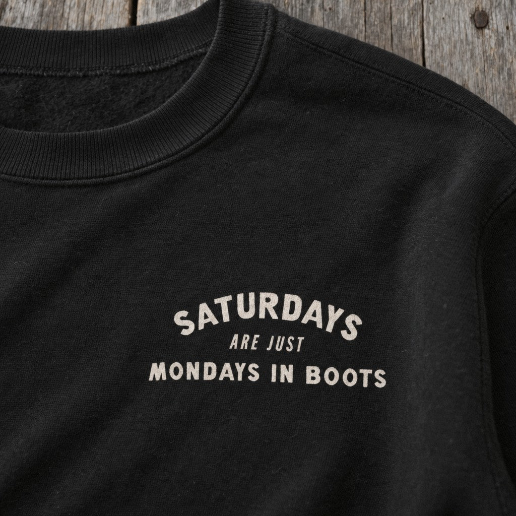 Saturday’s Just Monday in Boots Crewneck in Black, close-up front